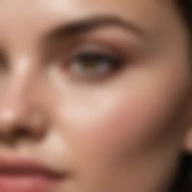 Close-up of a skincare regimen featuring a serum being applied to the skin.