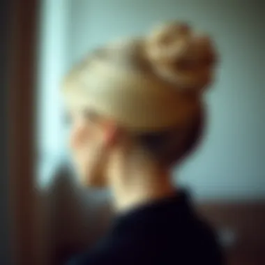 Elegant tight bun hairstyle on a model
